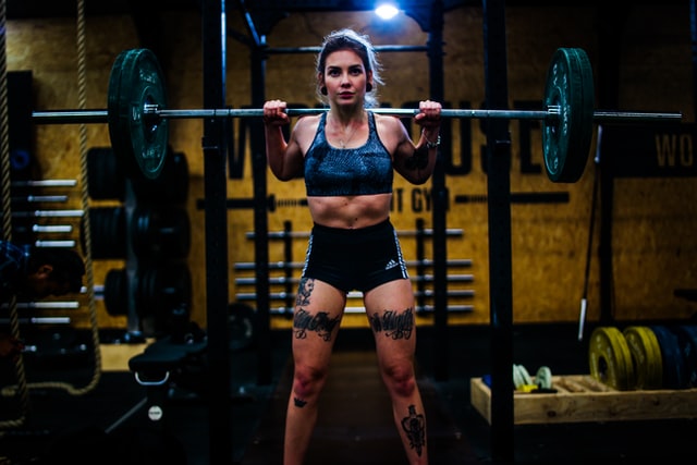 Woman carrying barbell